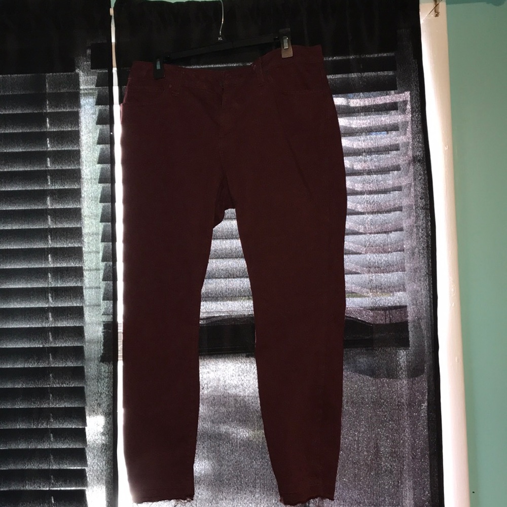 Maroon jeans.